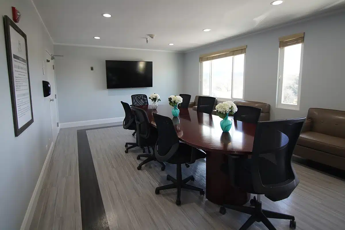 A long conference room table at Marin Post Acute